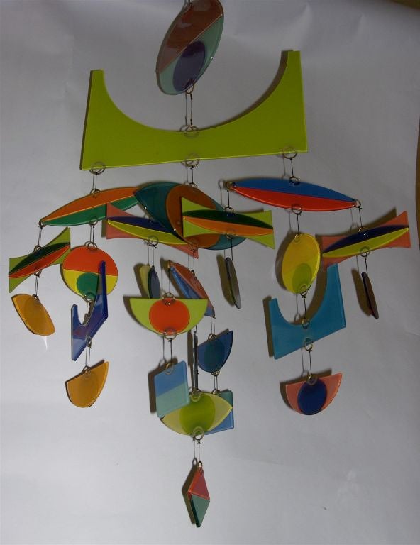 This wonderful mobile was designed and made by Michael Higgins in 1980. During this time period, Higgins glass was out of fashion and there were very few mobiles made. This piece came from the private collection of a long time representative of the