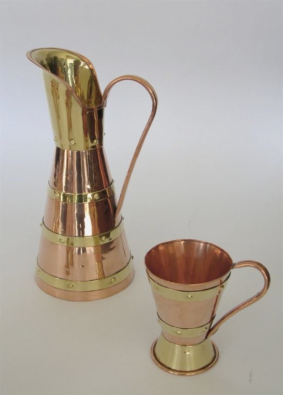Great for Beer. Made in Mexico in the 1950's, this beautiful set is modern in design yet has all the charm of it's hand forged metal. Each piece has the embossed stamp of the Hector Aguilar workshop. The pitcher is 13