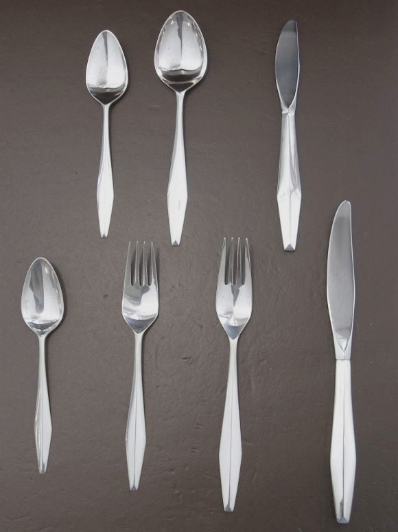 This wonderful sterling silver flatware is called the Diamond Pattern. It was designed by Gio Ponte and produced by Reed and Barton. There is a complete seven piece service for 12 as well as nine extraordinary serving pieces. Each piece fits