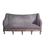 Large upholstered and gilded sofa