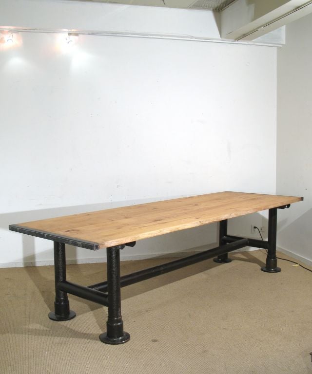 A Contemporary Wooden Table Composed from Recycled Metal Parts