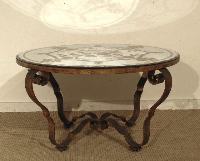 A Small Round Verre Eglomise Cocktail Table