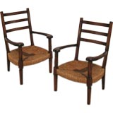 A Pair of Stained Oak and Rush Fauteuils