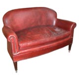 Leather upholstered loveseat with nailhead detail