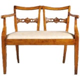 A Continental Fruitwood Settee