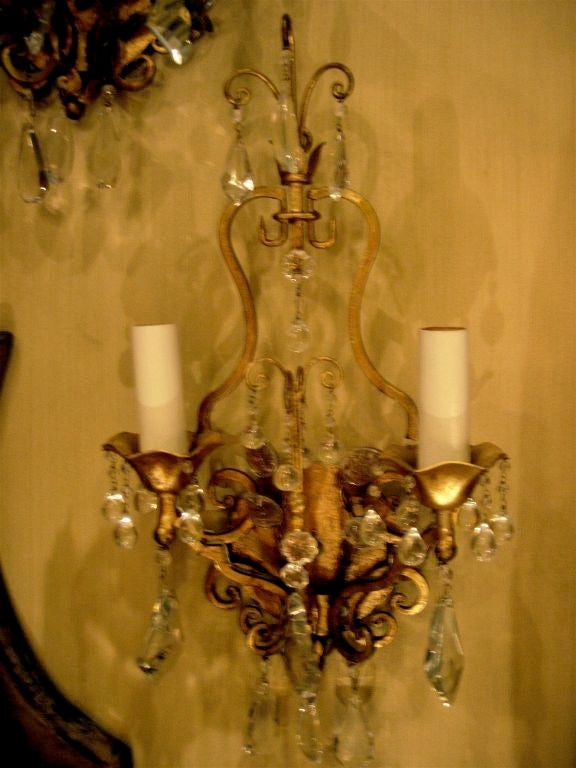 Elegant pair of vintage Sherle Wagner sconces, gilt metal hung with cut crystal drops. Newly wired.