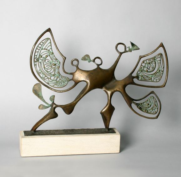 This sculpture has a wonderful interaction with light and can be viewed from all angles. Signed and dated by the artist, Clyde Ball, 1977.