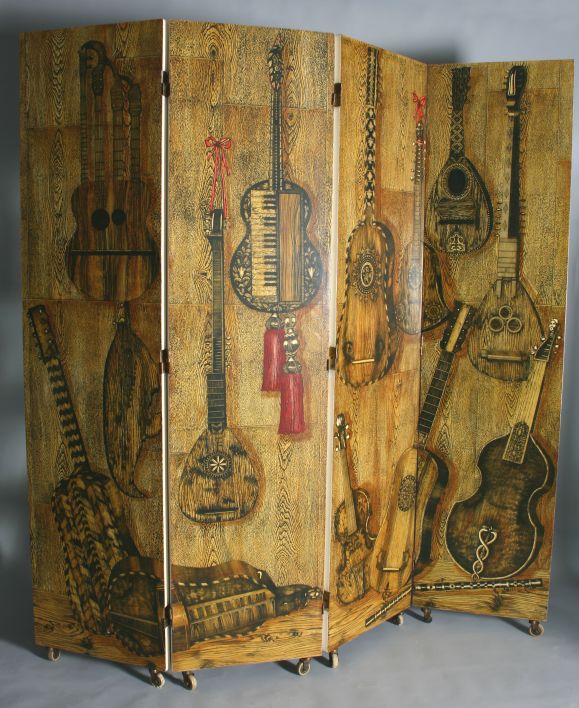 This absolutely spectacular and somewhat unusual Fornasetti screen features a city by the sea theme on one side and stylized musical instruments on the other.  The detail and quality are exceptional.