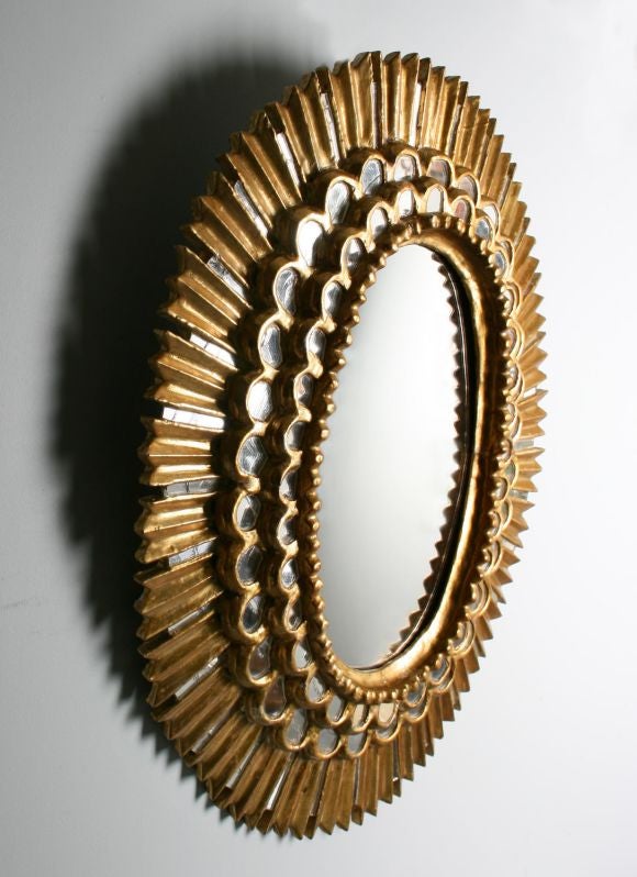 This is a very fine example of a Sunburst Mirror with rays of alternating carved wood and mirror