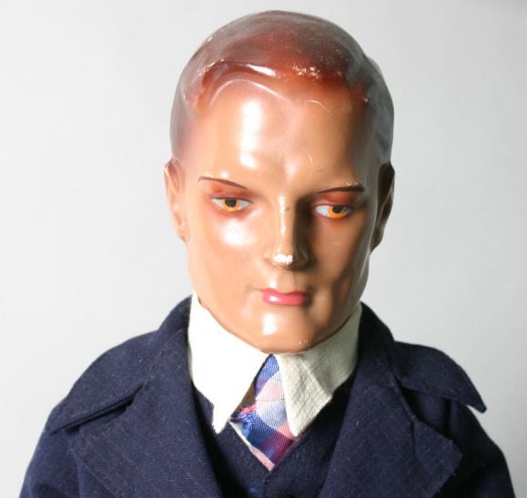 This mannequin dressed in a 3 piece suit, displays the fashion of his day. His striking face has wonderful detail.