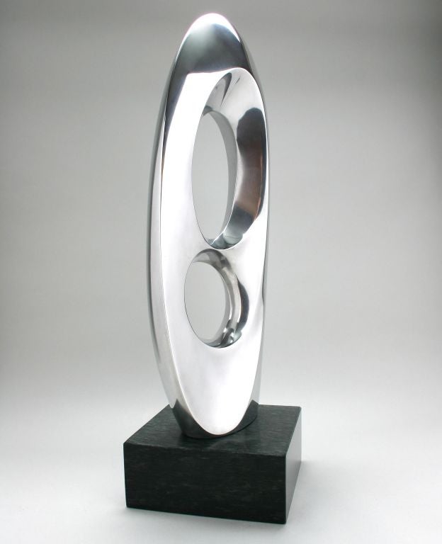 This is a wonderful example of Mid Century design by Michael Barkin. This sculpture looks good from every angle.  A student of Alexander Archipenko, his work is in the Metropolitan Museum of Art.