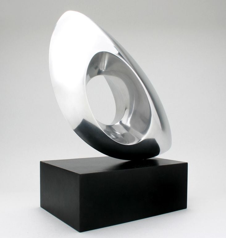 This is a wonderful example of Mid Century design by Michael Barkin. Very nicely done, this sculpture looks good from every angle. A student of Alexander Archipenko, his work is in the Metropolitan Museum of Art.  It is signed with his signature