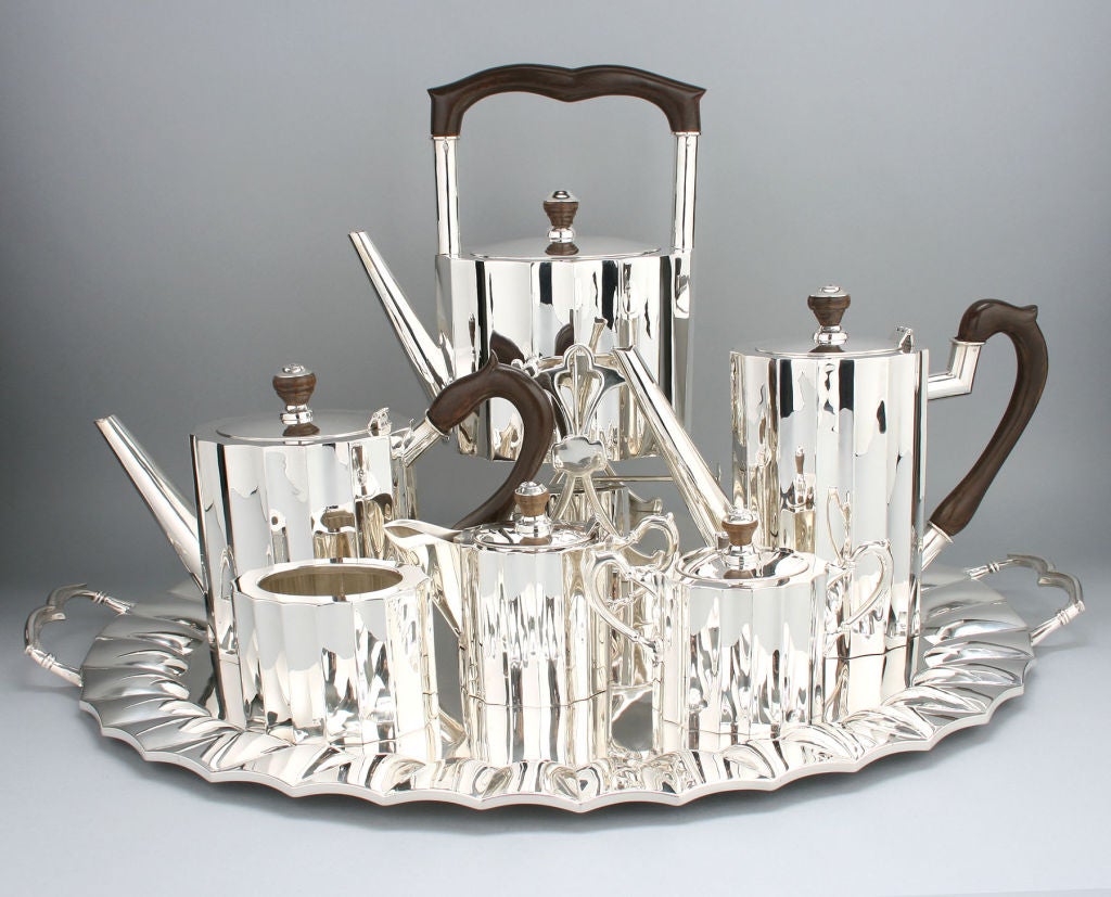 This is a beautiful, substantial and well designed set. The feel is heavy and luxurious. It consists of an under tray, tea pot, coffee pot, hot water pot with warmer, sugar, creamer and of course the waste pot.