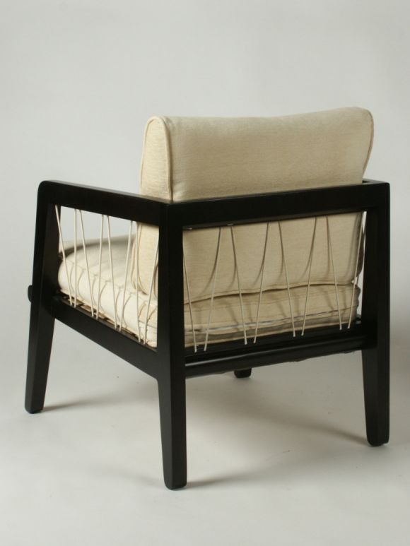 Pair of Edward Wormley Precedent Collection for Drexel lounge chairs, c.1947, dark stain on silver elm with woven nylon cording that zig zags between frame arm and seat. Cushions upholstered in ivory chenille fabric.