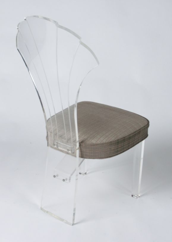 Lucite shell back chair with velvet upholstered seat cushion.