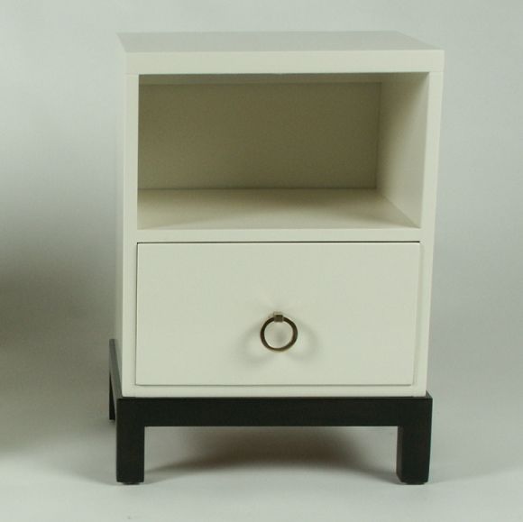 Matching pair of nightstands in snowflake lacquer with brass ring hardware. Parson's legs in dark brown mahogany