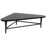 Large rounded triangular cocktail table