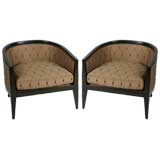 Pair of barrel back midcentury lounge chairs