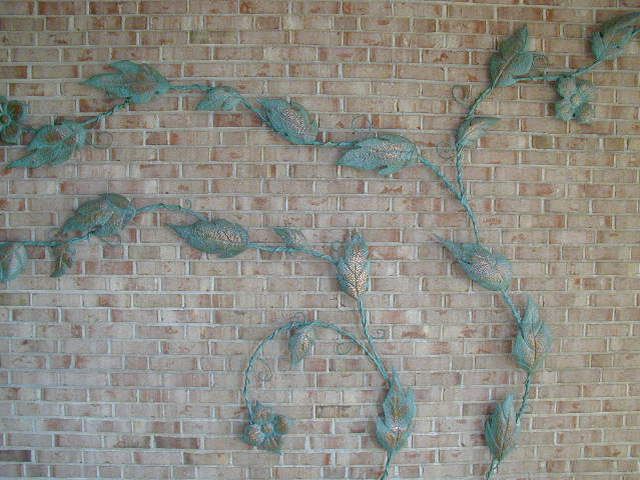 This piece is an early example of artist William Conrad Severson work on copper. This large botanical form highly stylized in copper with applied patina, was commissioned in early 1950s and installed in the home of St. Louis modernist architect