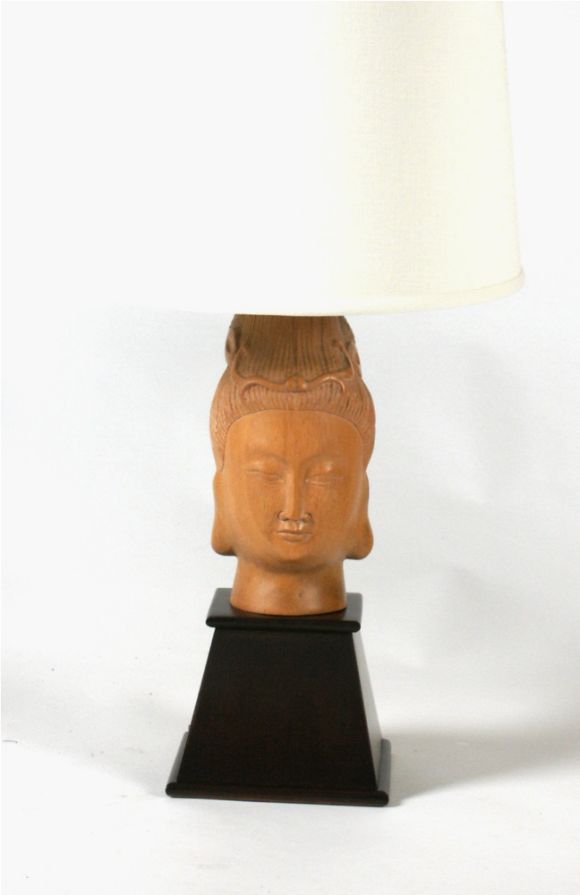 Pair of Asian Modern table lamps with sculpted female heads in bleached wood with ebonized bases, modern linen shades.
