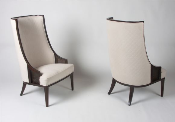 Pair of elegant tall back lounge chairs, dark walnut frames with cane insets below arm, reupholstered in quilted ultra suede.