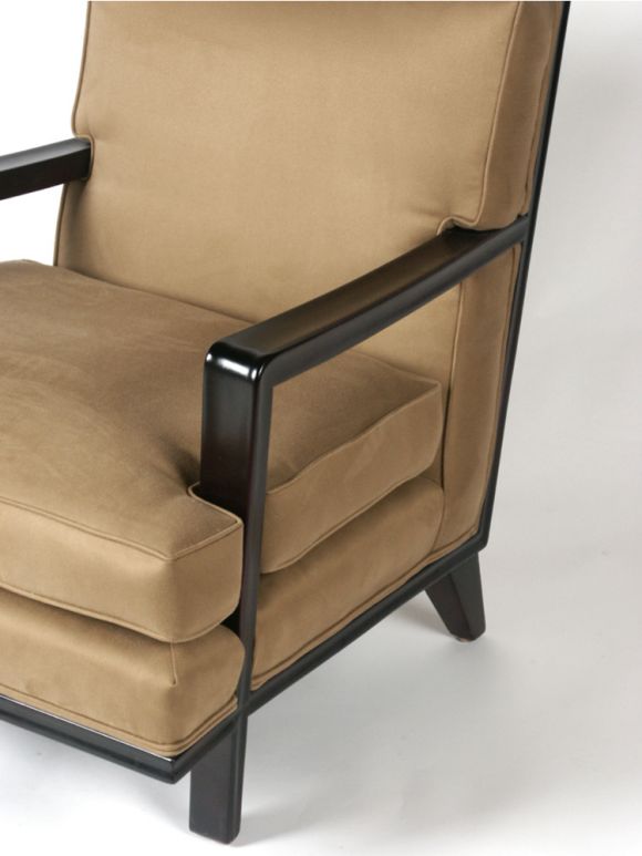 Large scale club chair, channeled dark brown mahogany frame with thick picture frame back, sculptural arms intersect with seat cushion, reupholstered in taupe fabric.