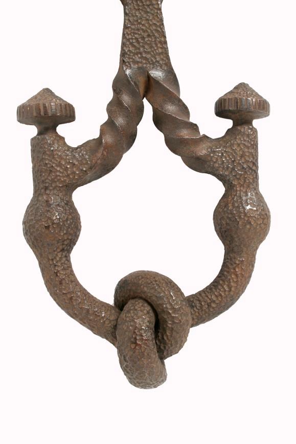 An imposing French wrought iron door-knocker, signed 'A. Roques, Albi 1930.'