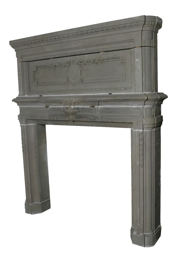 A French carved stone fireplace mantel, circa 19th century.<br />
<br />
Firebox Dimensions: 48