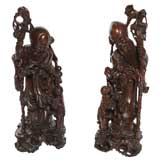 PAIR OF CARVED TEAK STATUES