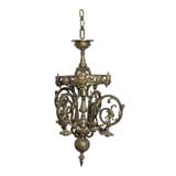 BRONZE CHANDELIER WITH FACES AND GRIFFINS