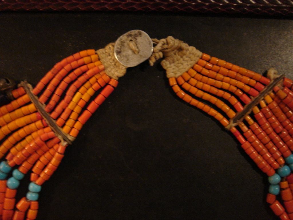 A Northern Indian Naga necklace decorated with bells, hand made by the Bead People (near Burma). One strand is made by families for each generation.
