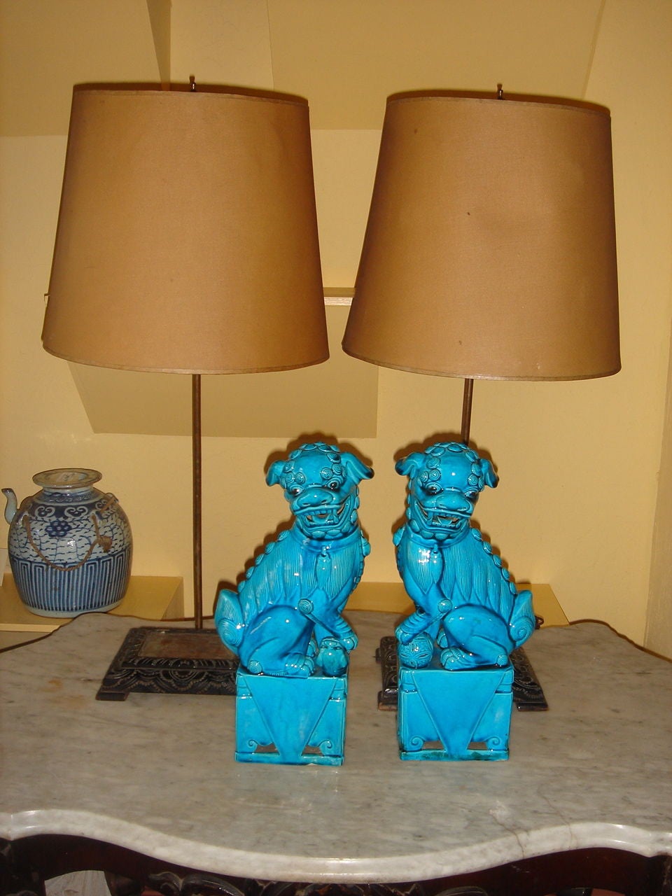 Turquiose Foo Dog Statues sit on hand carved Lamp Stands with brass rods which can be shortened or made higher with half lamp shades. Note: Statues are separate from lamp stands.