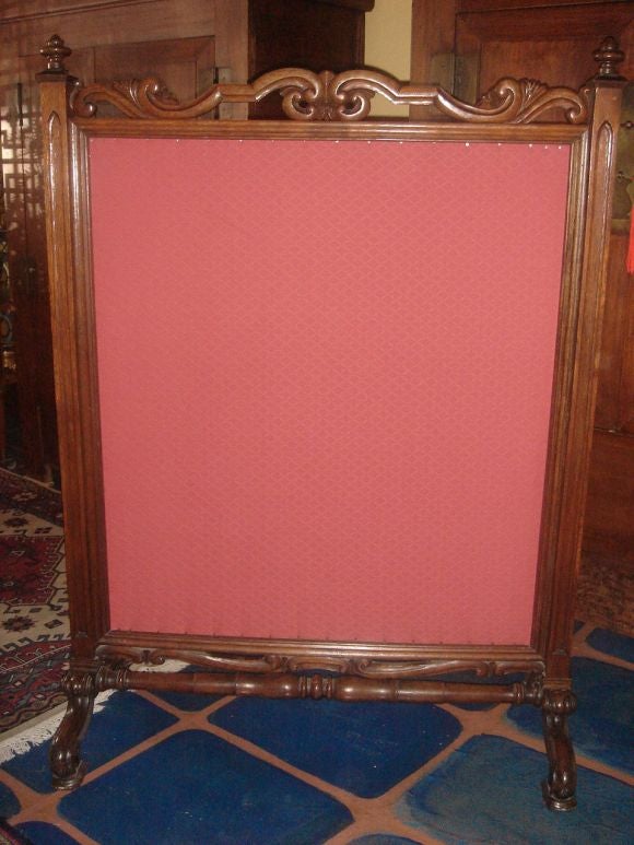 An English Victorian walnut free-standing firescreen, tapestry on one side, fabric on reverse side