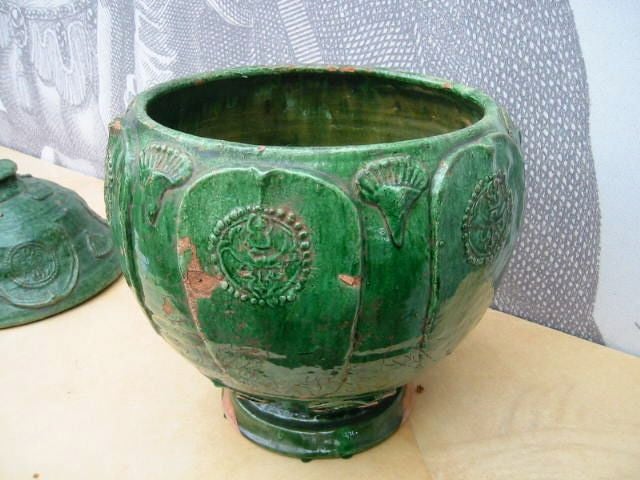 Yuan Dynasty Green Glazed Jar <br />
Decorated with circular geometrical shapes & lotus design