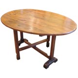 19th. c. honey colored walnut oval wine  tasting table.