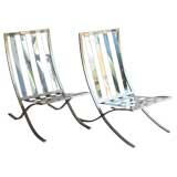 PAIR OF IRON LOUNGE CHAIRS