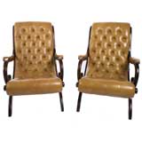Pair of leather button tufted chairs