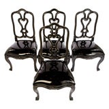 Set of four Dining chairs with black patent leather.