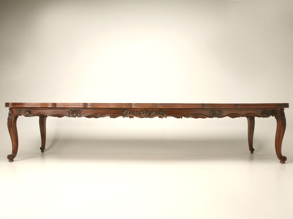This exemplary table is a custom creation done in our own on-site workshop to solve a designer's dilemma. The project started with a 5' long French draw-leaf table from the 1920's. The table had two 19