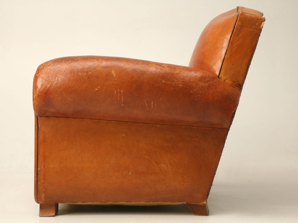 Suite of 4 matching vintage French mustache back club chairs in the original leather. These chairs were constructed utilizing springs in the seat cushions and not foam as were the later models. Priced as a set of four.