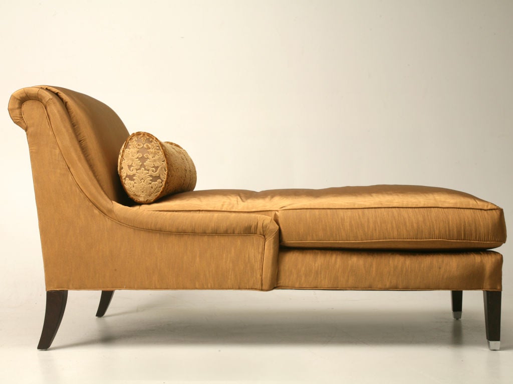 Reproduction chaise in ginger fabric. It's a lot of look for very little money. Extremely comfortable.