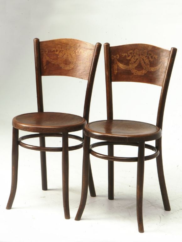 Pair of bentwood chairs with neoclassical decorations on seats and backs