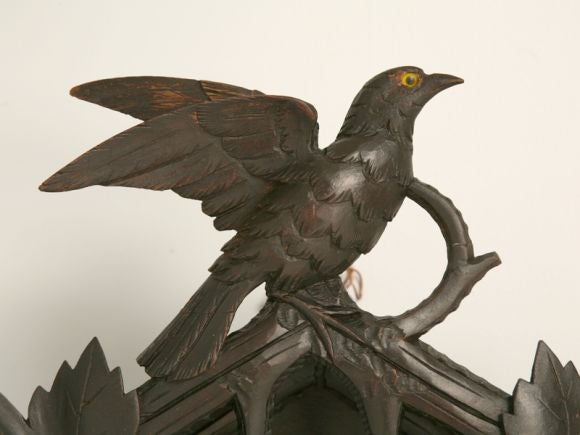 Antique hand carved Black Forest cuckoo clock. Every quarter hour two different quail sound.