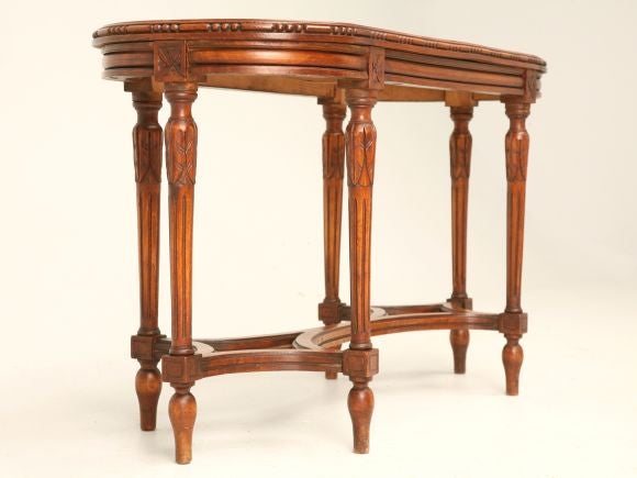 Antique walnut Louis XVI style piano bench with caned seat, die join joints, beaded trim and fluted legs.