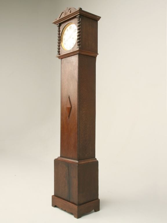 Oak grandmother clock made by Hamburg American Clock Co. a German company (1883-1929). The back reads 