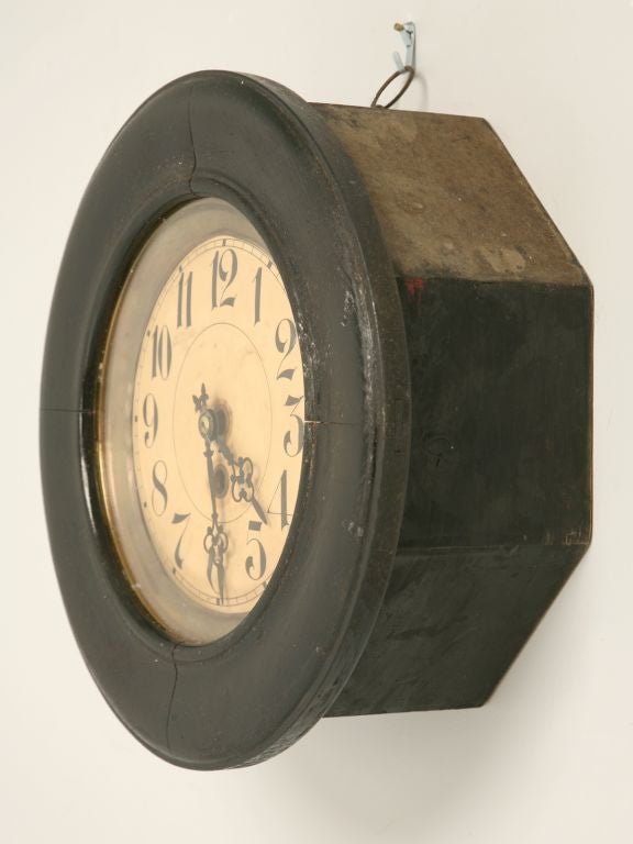 Antique black painted clock with a brass trim. Would look great in that country French kitchen as a wall decoration. This clock does not work. We bought it because we think it has a great look.
