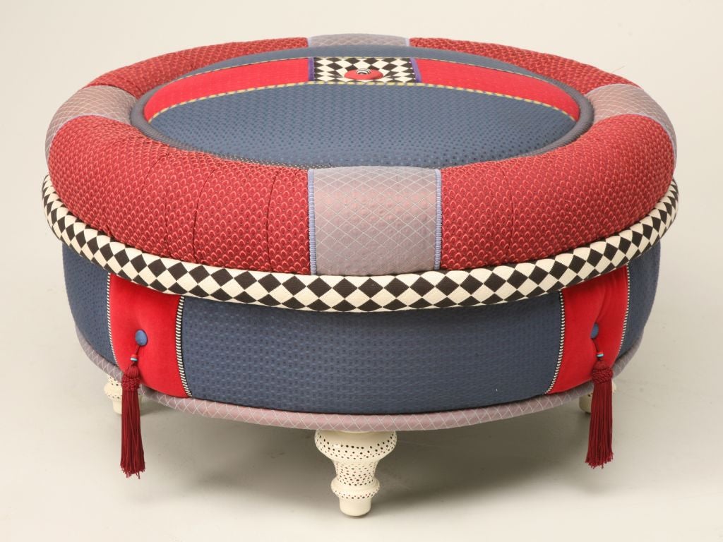 Unique fun and colorful round ottoman with poka-dot painted legs.