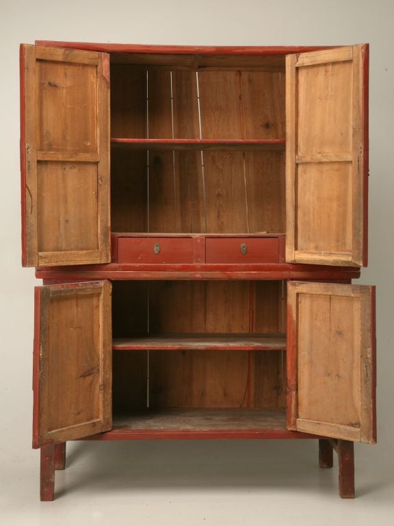 Beautifully hand painted Chinese red lacquer two piece cabinet with a butterfly motif and two fitted interior drawers.