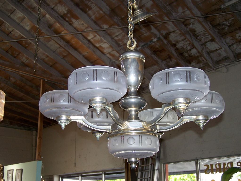 French seven lights chandelier with glass shades and nickel plated patina (original).