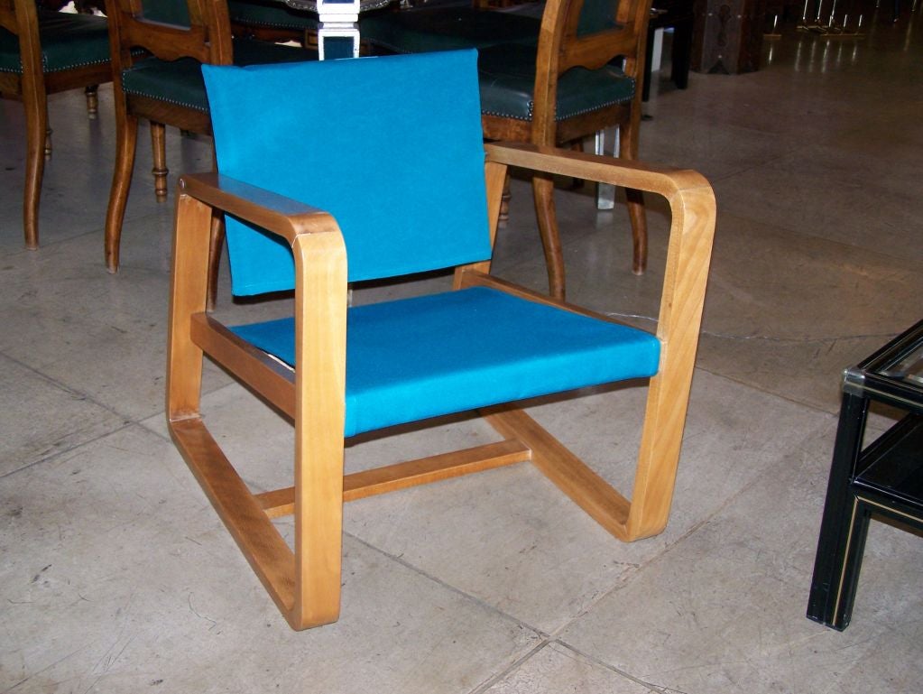 French fauteuil upholstered with turquoise color fabric.